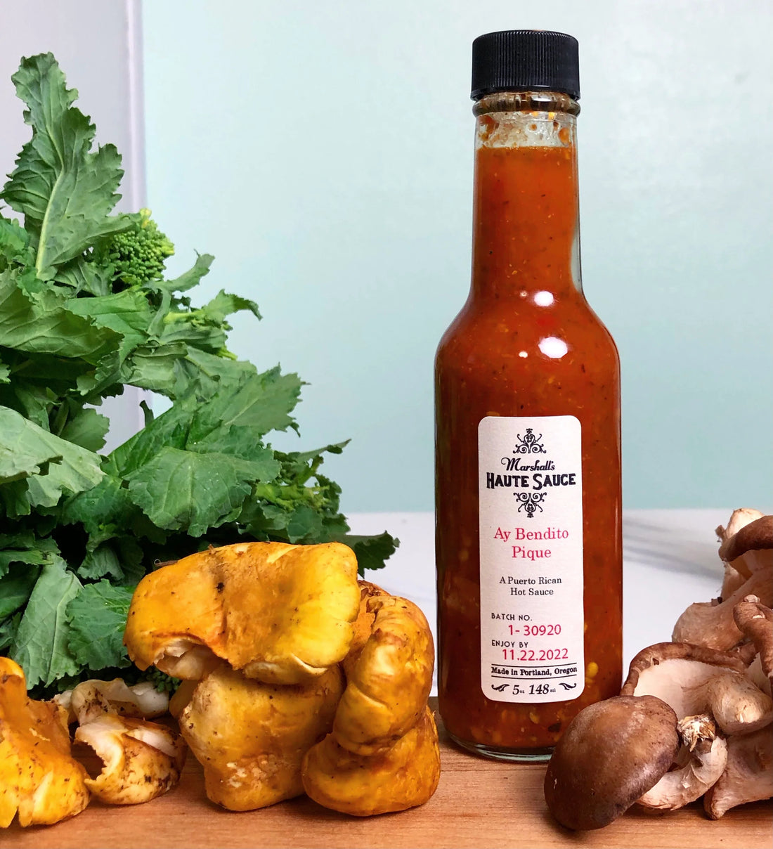 pique sauce sitting on a cutting board with mushrooms