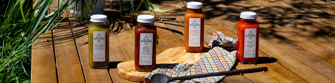 Bottle of Habanero Carrot Curry sauce with pearl barley grains