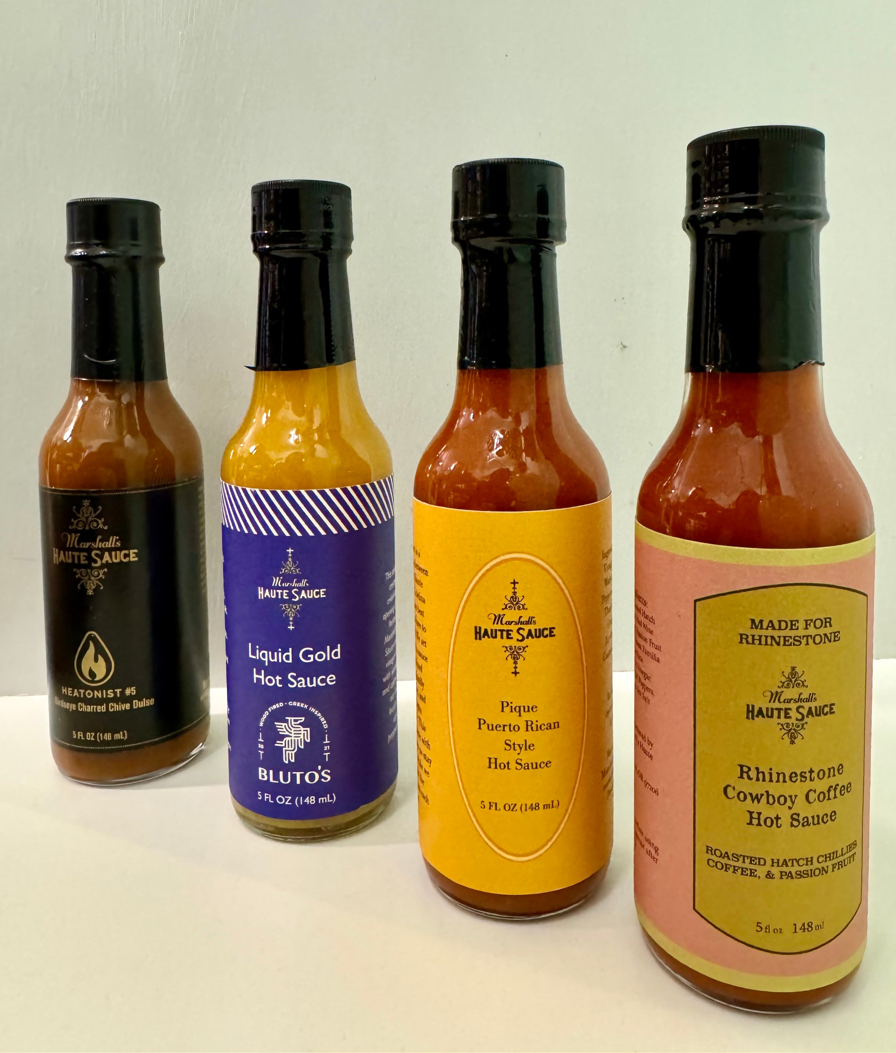 Limited edition gift box with four 5-ounce gourmet hot sauces including Bluto's Liquid Gold.