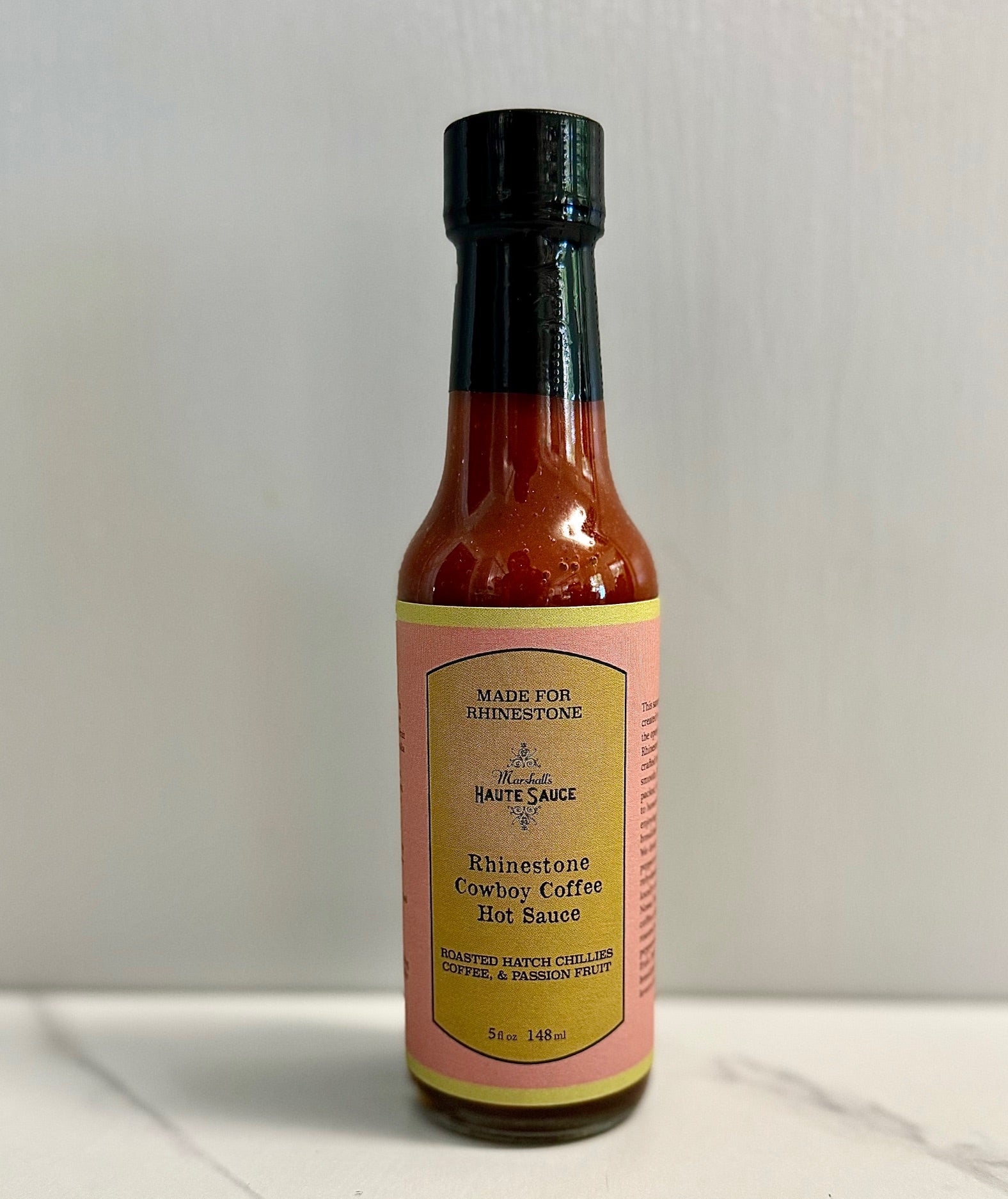 Rhinestone Cowboy Coffee Hot Sauce bottle showcasing its unique flavors for breakfast burritos.