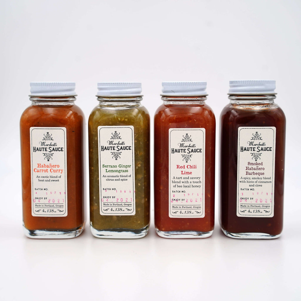 four bottles of marshall's haute sauce